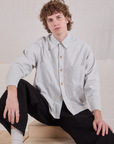 Quinn is wearing a buttoned up Cropped Overshirt in Stone White