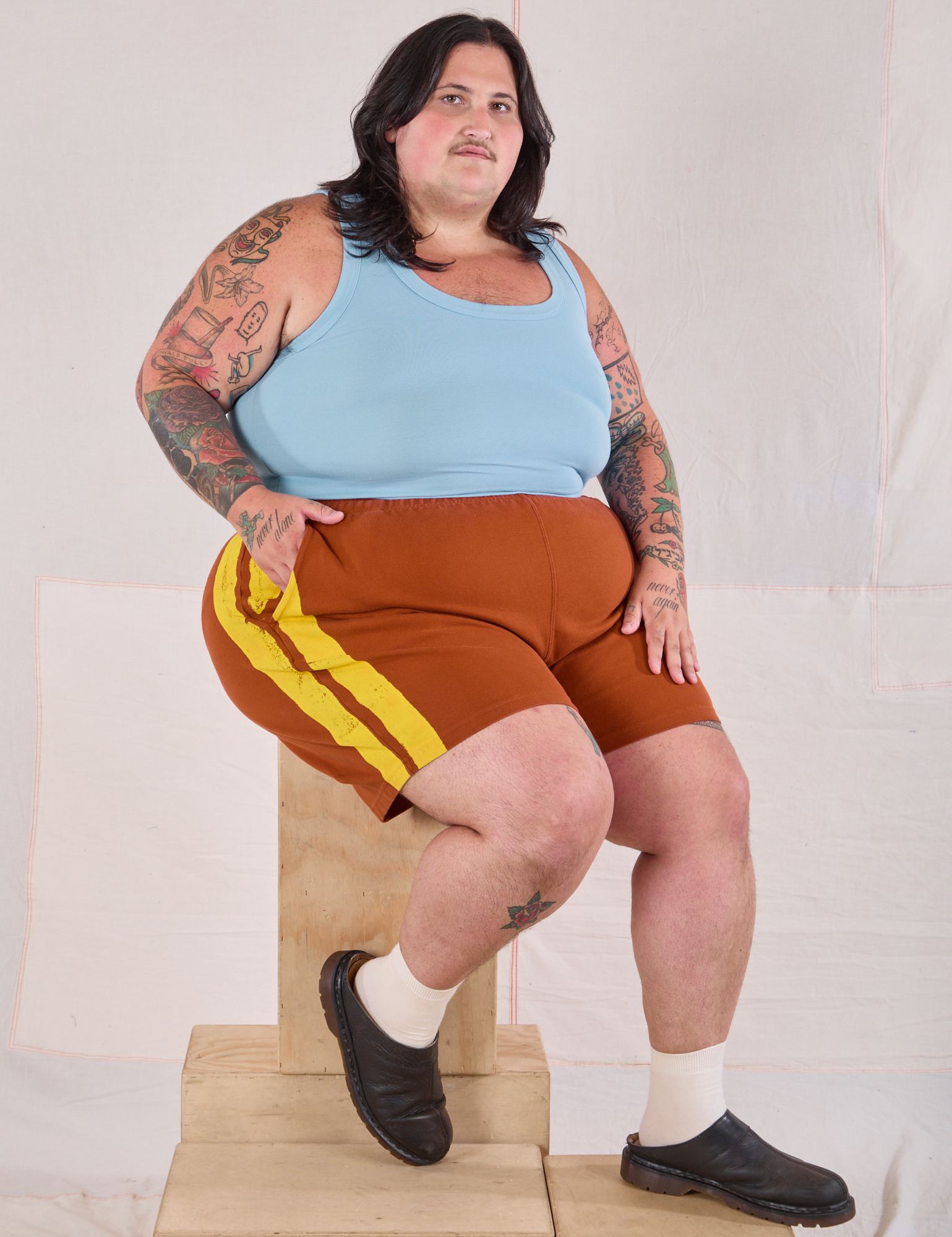Painted Stripe Easy Shorts in Burnt Terracotta paired with baby blue Cropped Tank on Sam
