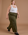 Juliet is wearing Drop Pocket Cargo Pants in Surplus Green paired with a Cropped Tank Vintage Tee White