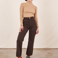 Soraya is 5'2" and wearing Petite XXS Work Pants in Espresso Brown paired with Essential Turtleneck in Tan