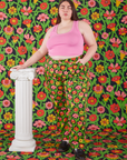 Marielena is 5'8" and wearing 2XL Work Pants in Flower Tangle paired with bubblegum pink Cropped Tank Top