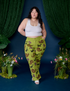 Ashley is 5'7" and wearing 1XL Paintstamped Work Pants in Froggy paired with vintage tee white Cropped Tank