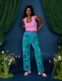 Kandia is 5'3" and wearing XS Paintstamped Work Pants in Lilypad paired with bubblegum pink Cropped Tank