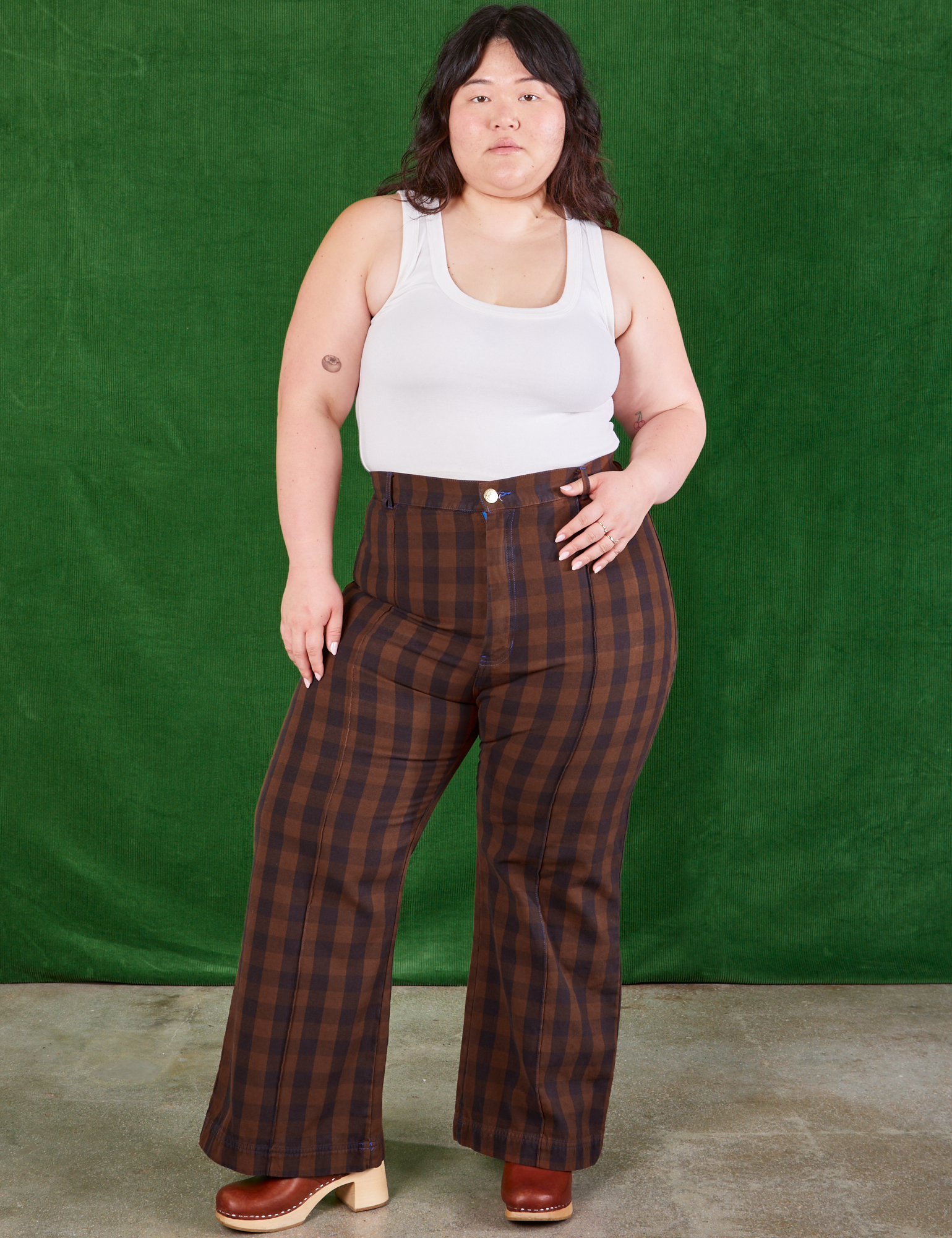Ashley is 5&#39;7&quot; and wearing 0XL Gingham Western Pants in Fudge Brown paired with Cropped Tank in vintage tee off-white