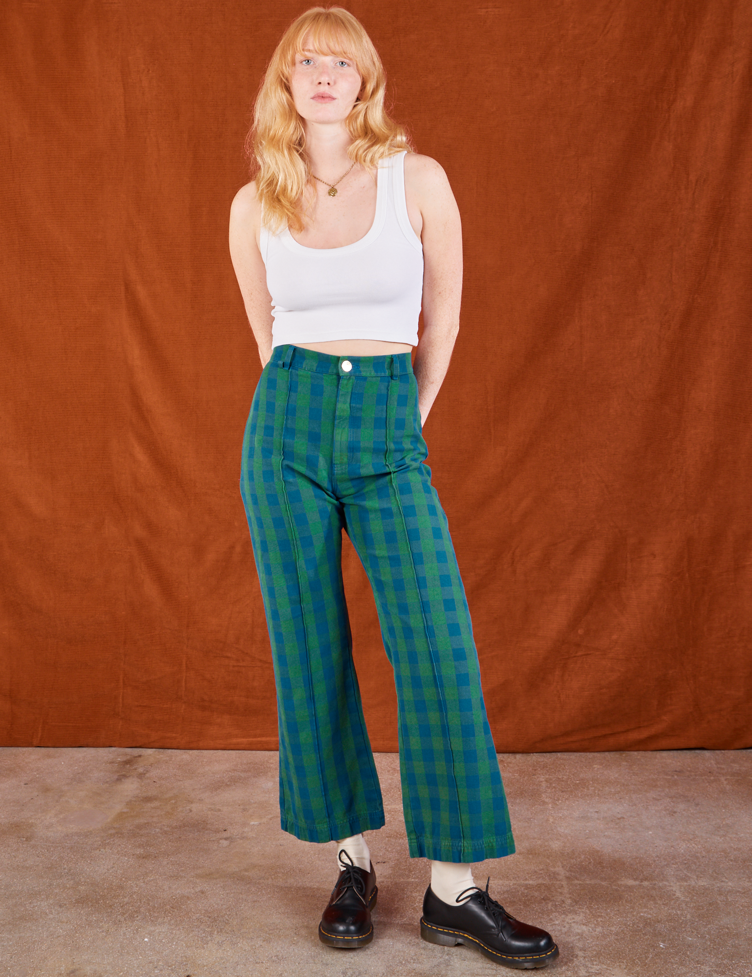 Margaret is 5'11" and wearing XS Gingham Western Pants in Green paired with a Cropped Tank in vintage tee off-white