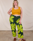 Lish is 5'8" and wearing XL Paintstamped Clover Work Pant paired with a Mustard Yellow Cropped Tank