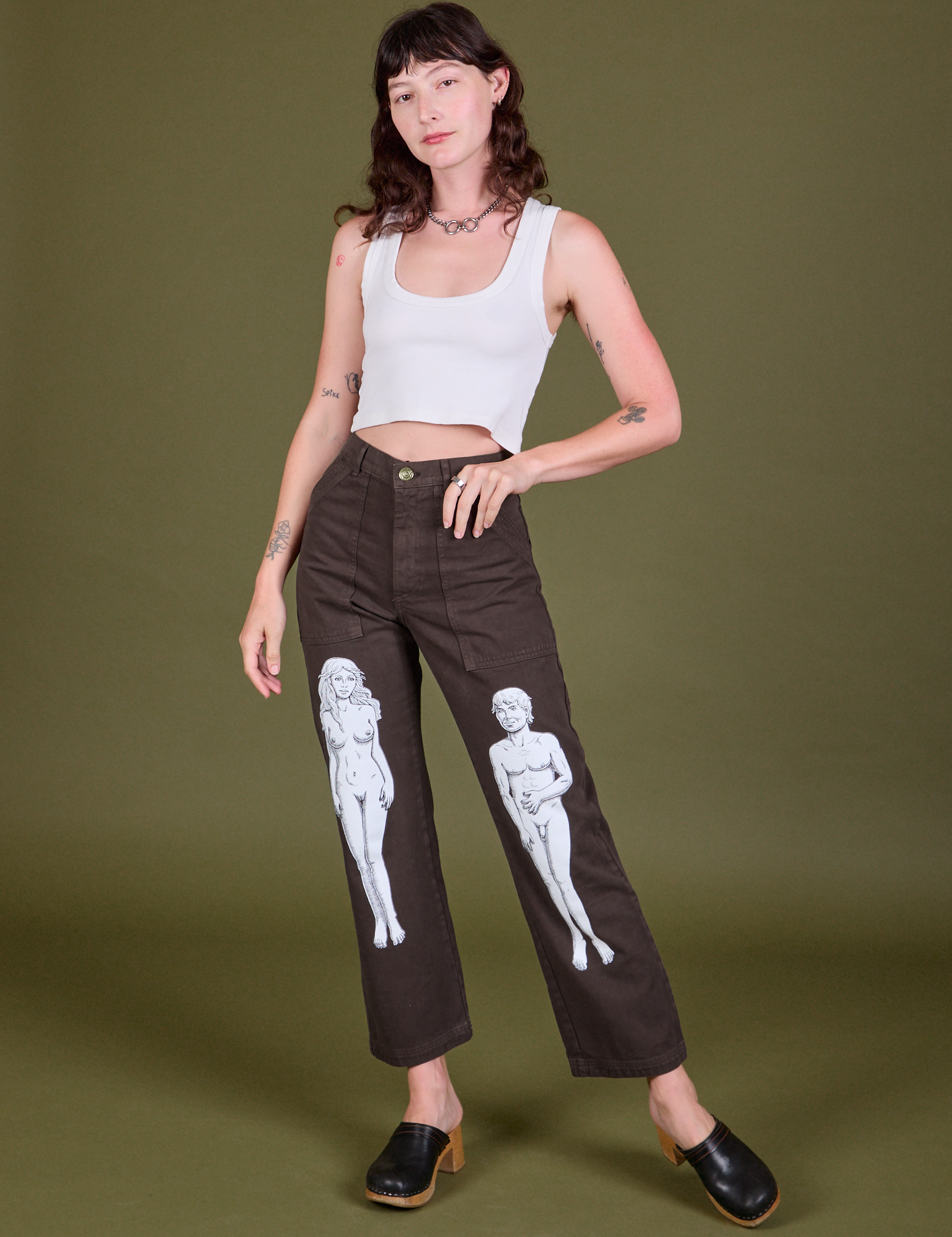 Alex is 5'8" and wearing XS Guy Colwell Work Pants in Woman & Man paired with a Cropped Tank in Vintage Tee Off-White