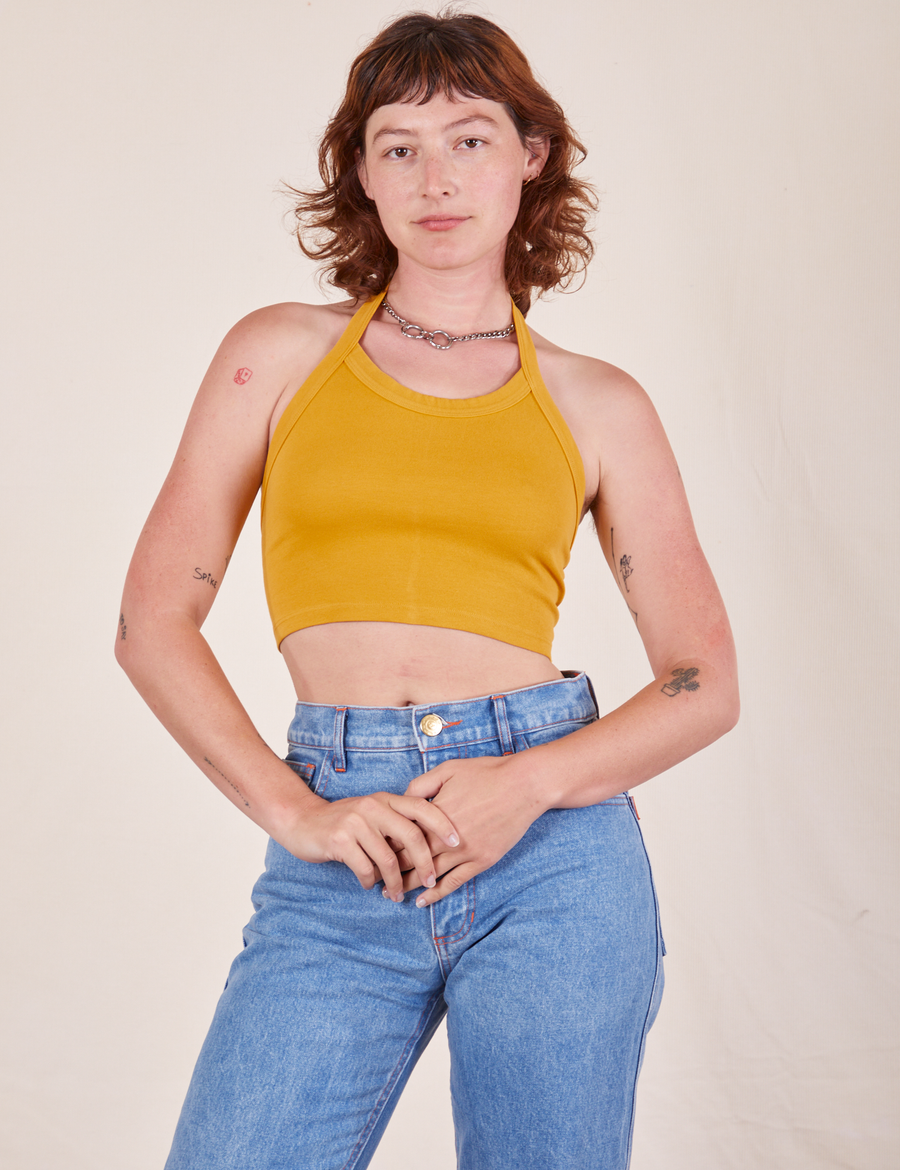 Alex is 5'8" and wearing P Halter Top in Mustard Yellow