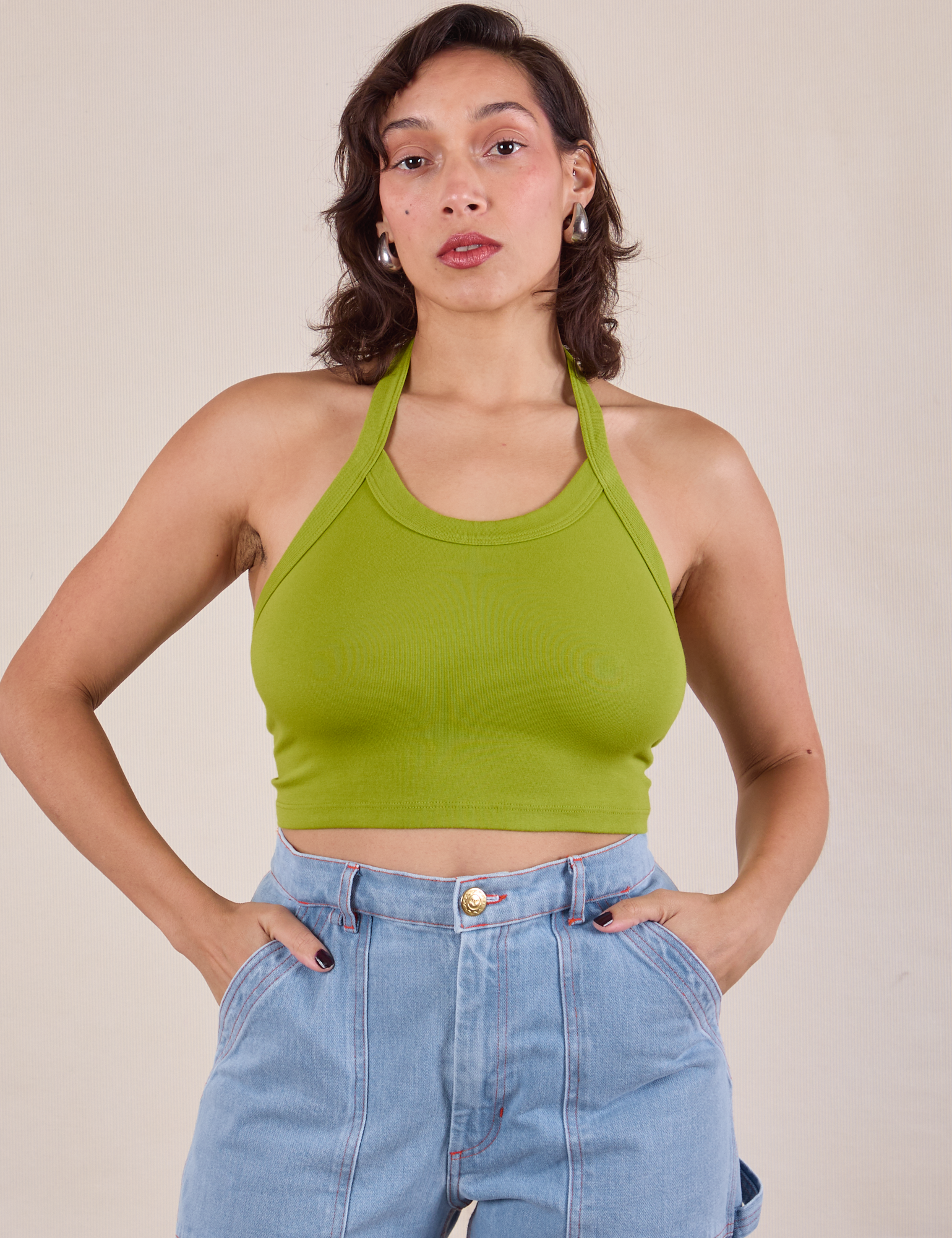 Tiara is 5'4" and wearing XXS Halter Top in Gross Green