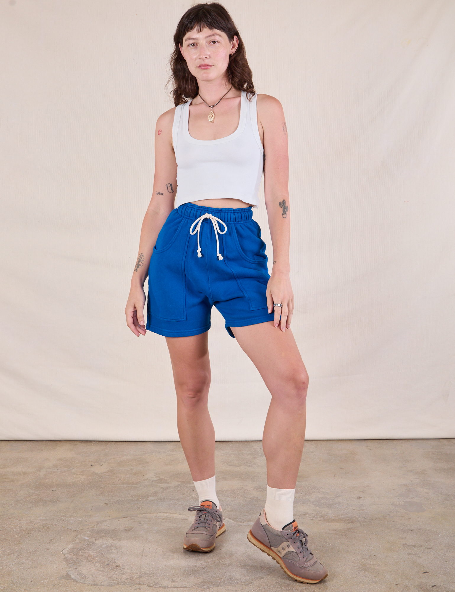Alex is 5'8" and wearing XXS Heavyweight Sweat Shorts in Royal Blue	 paired with a Cropped Tank in Vintage Tee Off-White