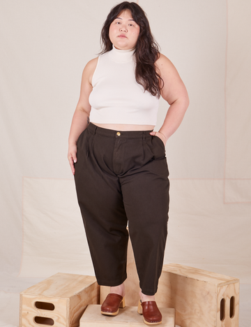 Ashley is 5'7" and wearing 1XL Petite Heavyweight Trousers in Espresso Brown paired with vintage off-white Sleeveless Turtleneck
