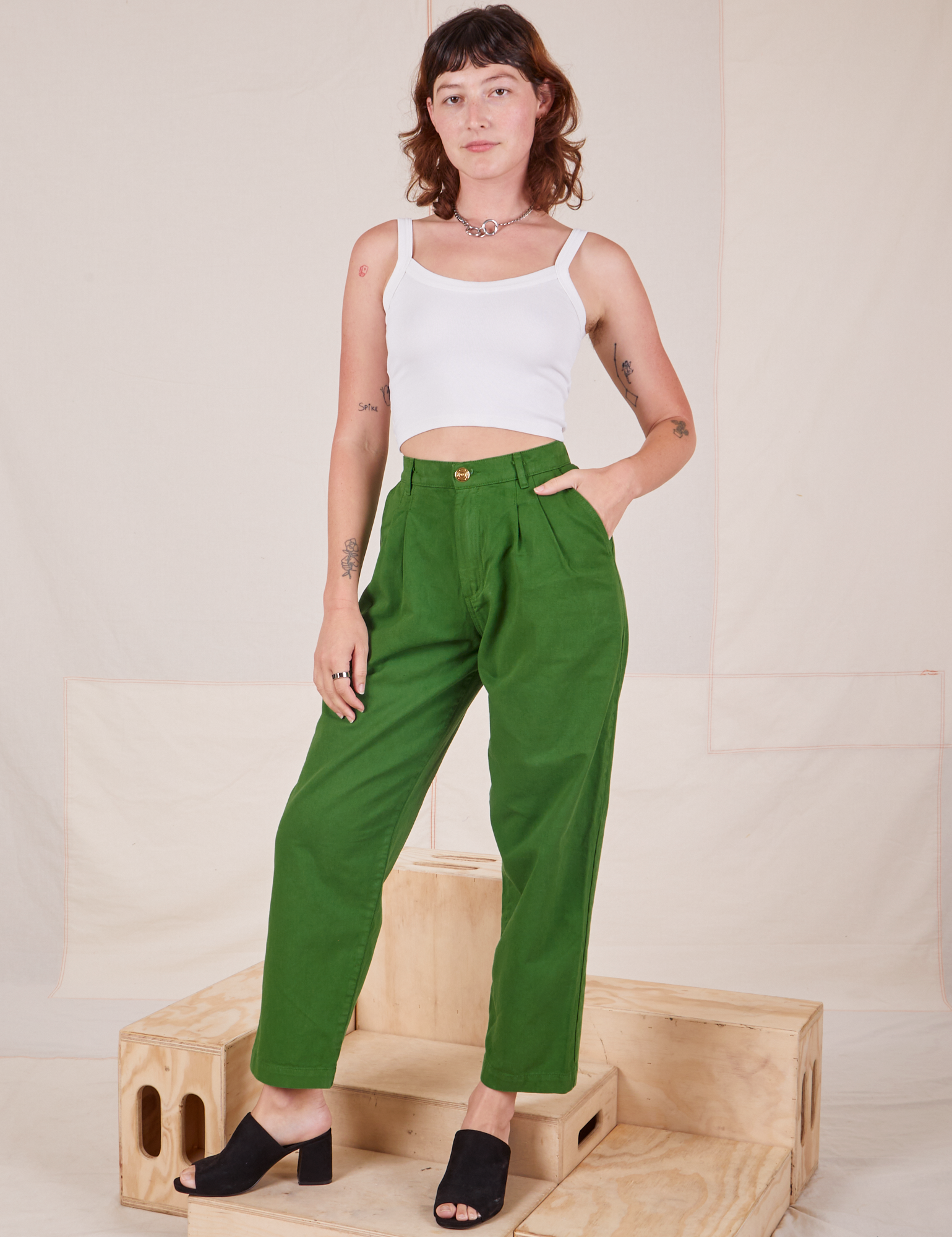 Alex is 5&#39;8&quot; and wearing XXS Heavyweight Trousers in Lawn Green paired with vintage off-white Cropped Cami