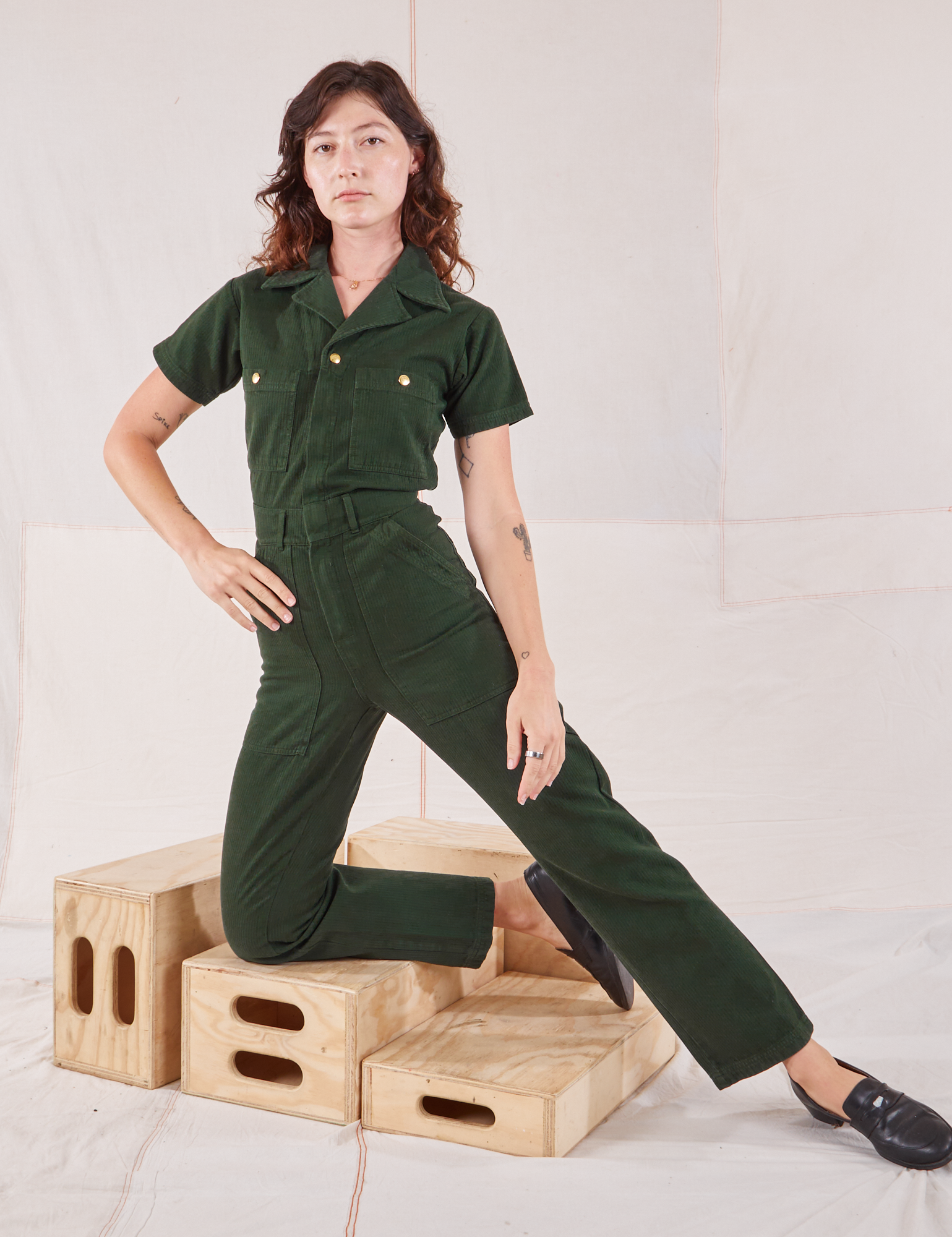 Alex is 5&#39;8&quot; and wearing XXS Heritage Short Sleeve Jumpsuit in Swamp Green