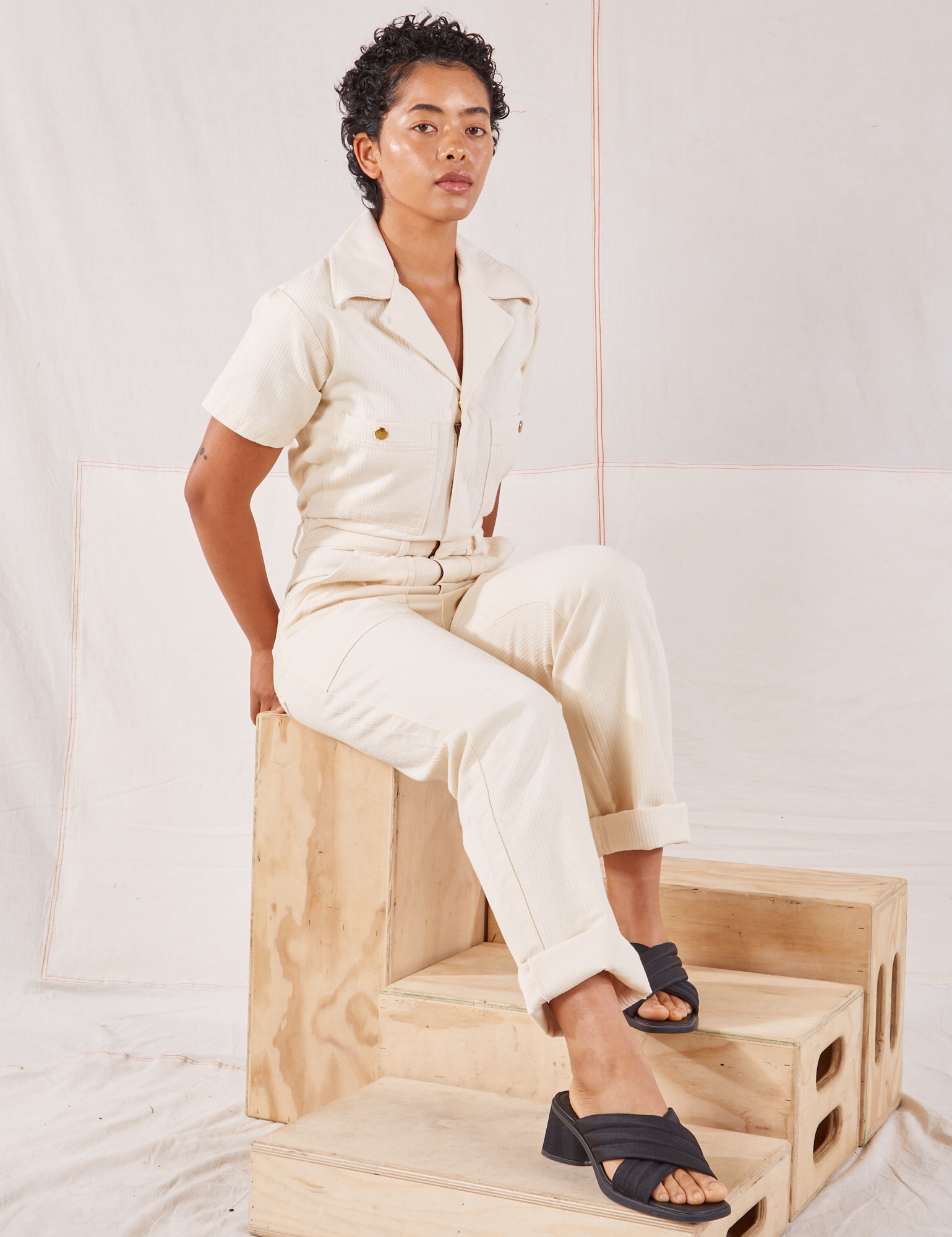 Mika is wearing Heritage Short Sleeve Jumpsuit in Natural