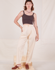 Alex is 5'8" and wearing XXS Heritage Trousers in Vintage Off-White paired with espresso brown Cropped Cami