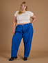 Juliet is 5’7” and wearing 2XL Heritage Trousers in Royal Blue paired with vintage off white Cropped Baby Tee