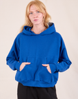 Margaret is 5'11" and wearing XS Oversized Hoodie in Royal Blue