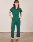 Hana is 5’3” and wearing XXS Petite Short Sleeve Jumpsuit in Hunter Green