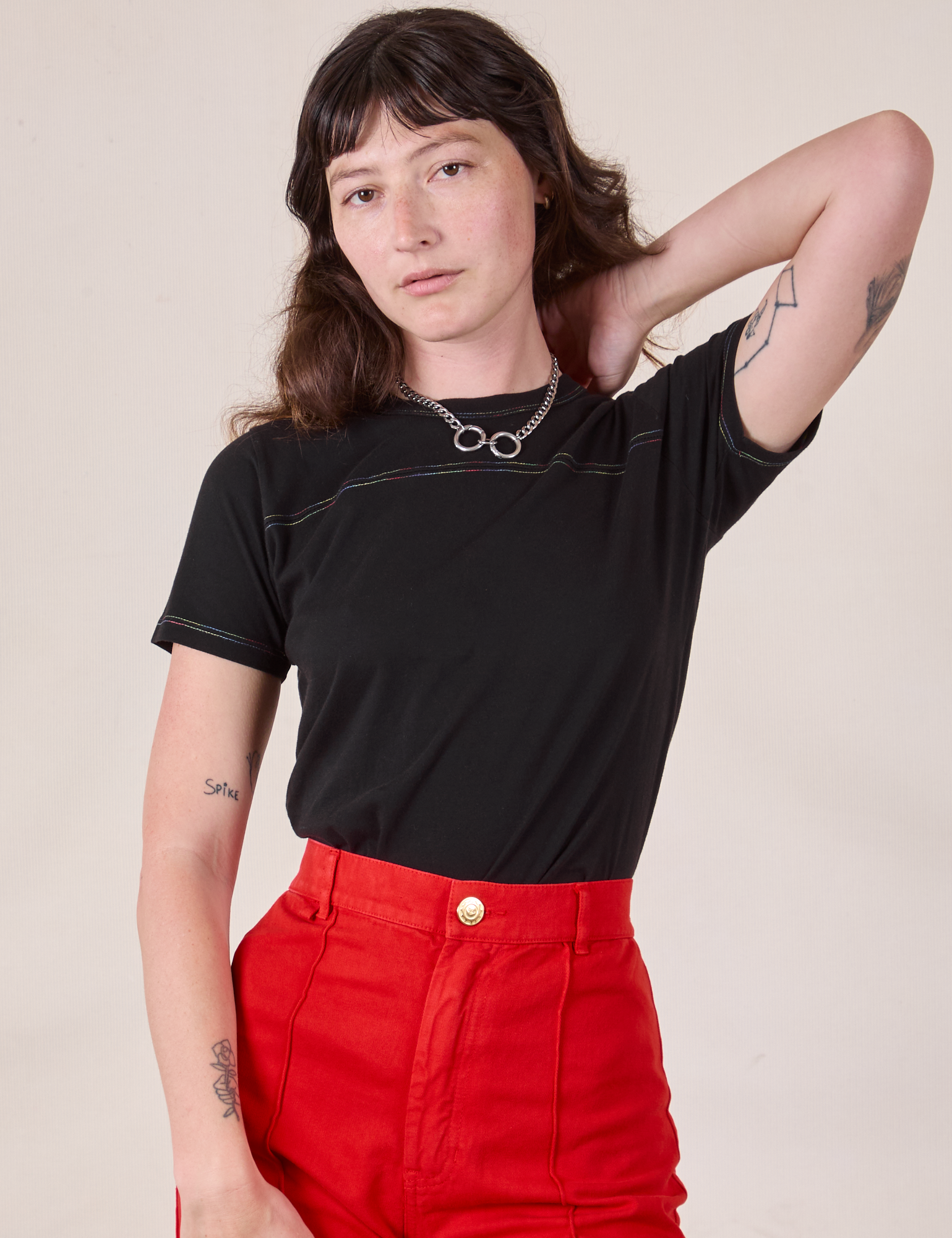Alex is 5'8" and wearing P Jr. Varsity Tee in Black Rainbow