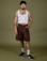 Jesse is 5’8” and wearing S Longline Work Shorts in Fudgesicle Brown paired with vintage tee white Cropped Tank