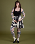 Sydney is 5’9” and wearing S Longline Work Shorts in Natural paired with black Cropped Tank