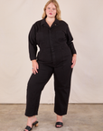 Juliet is 5'7" and wearing 1XL Long Sleeve Jumpsuit in Basic Black