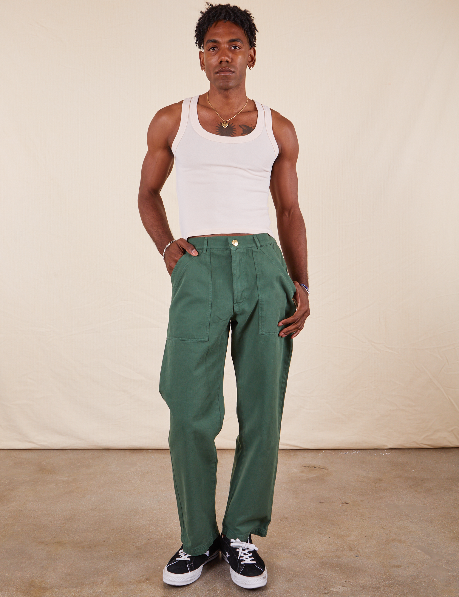 Jerrod is 6&#39;3&quot; and wearing Long S Work Pants in Dark Emerald Green