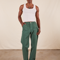 Jerrod is 6'3" and wearing Long S Work Pants in Dark Emerald Green