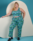 Juliet is 5’7” and wearing 1XL Work Pants in Angel Print paired with matching Cropped Tank
