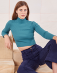Scarlett is 5'9" and wearing P Essential Turtleneck in Marine Blue paired with navy Western Pants
