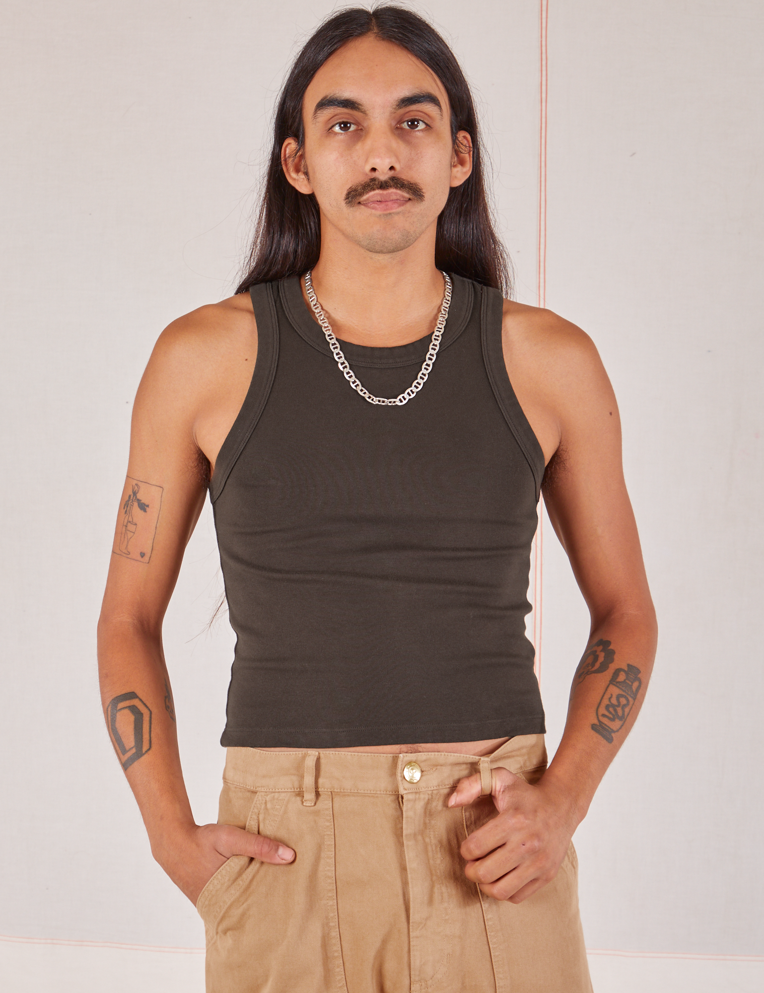 Anthony is 5’10” and wearing S Racerback Tank in Espresso Brown