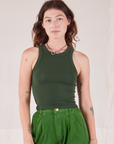 Alex is 5’8” and wearing P Racerback Tank in Swamp Green