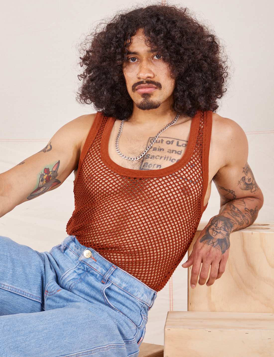 Jesse is 5'8" and wearing XS Mesh Tank Top in Burnt Terracotta