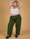 Juliet is 5'7" and wearing 1XL Baggy Mid-Rise Trousers in Evergreen