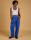 Jerrod is 6'3" and wearing M Baggy Mid-Rise Trousers in Royal Blue paired with vintage tee white Cropped Tank