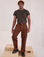 Issac is 5'10" and wearing M Mid-Rise Work Pants in Fudgesicle Brown paired with espresso brown Organic Vintage Tee