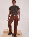 Issac is 5'10" and wearing M Mid-Rise Work Pants in Fudgesicle Brown paired with espresso brown Organic Vintage Tee