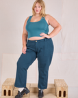 Juliet is 5'7" and wearing 2XL Mid-Rise Work Pants in Lagoon paired with marine blue Cropped Tank