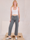 Margaret is 5'11" and wearing XS Mid-Rise Work Pants in Slate Grey paired with a Cropped Tank in vintage tee off-white