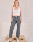 Margaret is 5'11" and wearing XS Mid-Rise Work Pants in Slate Grey paired with a Cropped Tank in vintage tee off-white