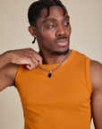 Front close up of Muscle Tee in Creamsicle Orange on Isaac