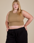 Juliet is 5’7” and wearing M Muscle Tee in Desert Brown