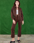 Alex is 5'8" and wearing XS Black Stripe Work Pants in Fudgesicle Brown paired with matching Ricky Jacket