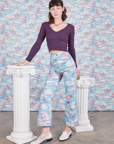 Alex is 5'8" and wearing XS Western Pants in Cloud Kingdom paired with nebula Long Sleeve V-Neck Tee