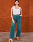 Tiara is 5'4" and wearing size S Overdye Stripe Work Pants in Blue/Green paired with vintage off-white Cropped Tank Top