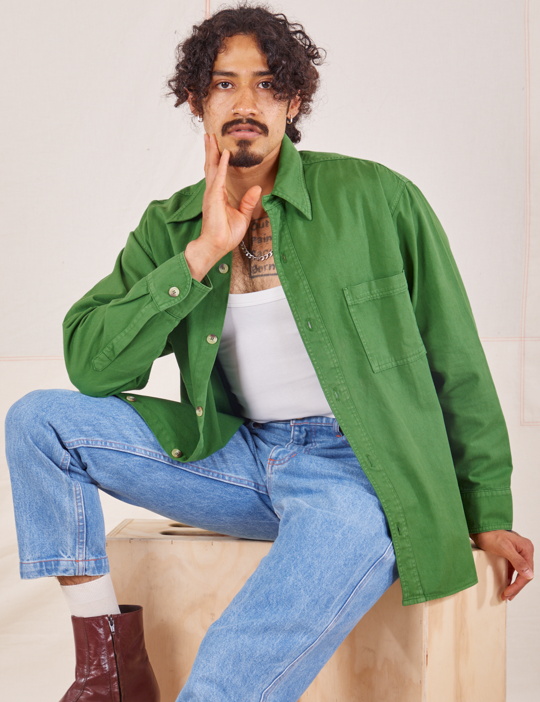 Jesse is wearing size S Oversize Overshirt in Lawn Green paired with vintage off-white Tank Top