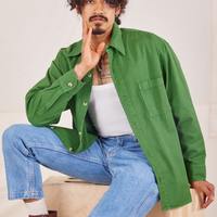 Jesse is wearing size S Oversize Overshirt in Lawn Green paired with vintage off-white Tank Top