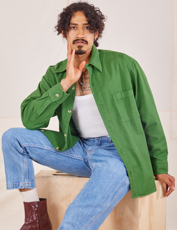 Jesse is wearing size S Oversize Overshirt in Lawn Green paired with vintage off-white Tank Top
