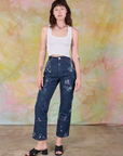 Alex is 5'8" and wearing XXS Painted Carpenter Jeans in Light Paint paired with vintage tee off-white Cropped Tank Top