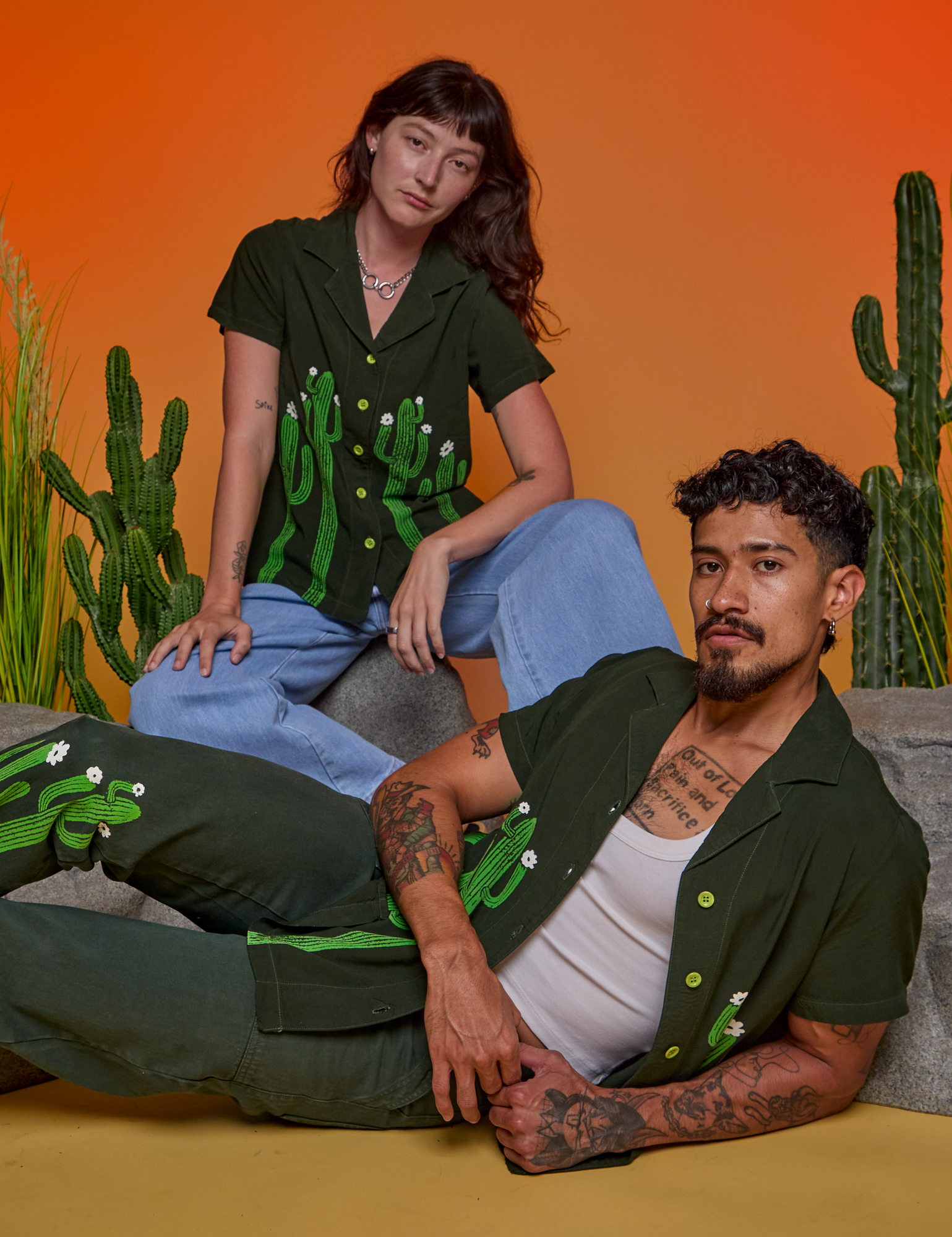 Alex is wearing Paintstamped Pantry Button-Up in Cactus. Jesse is wearing Paintstamped Pantry Button-Up in Cactus and matching Work Pants